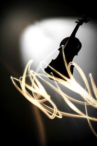 Close-up of guitar at night