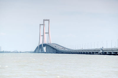 View of bridge over sea against sky