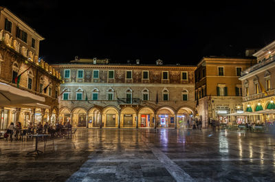 Buildings in city at night