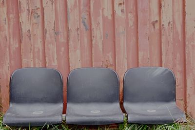 Directly above shot of empty chairs against wall