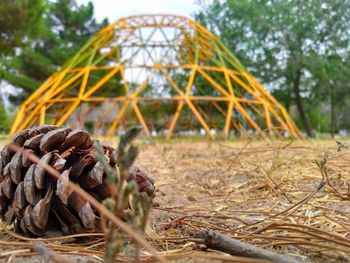 Close-up of rusty metal structure on field