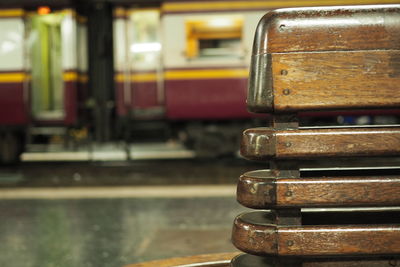 Close-up of bench at railroad station