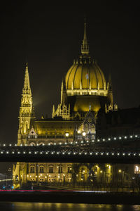 Illuminated cathedral against sky at night