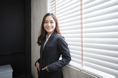 Portrait of confident businesswoman standing in office