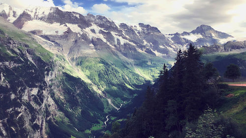 Scenic view of landscape and mountains against sky