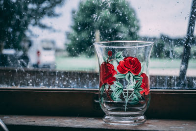 Drinking glass on window sill