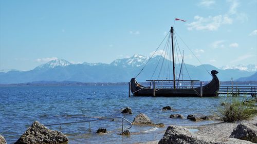 Sailboat on sea against sky