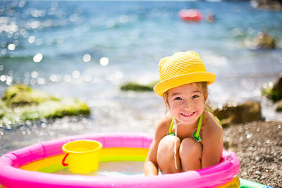 Portrait of smiling girl in swimming pool