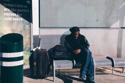 Man looking at camera while sitting in bus