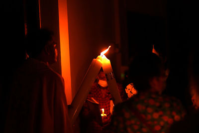 Group of people against fire in the dark