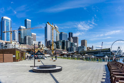 Pier 62 and tall skyscrapers at the waterfront in seattle, washington.