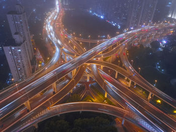 High angle view of light trails on highway at night