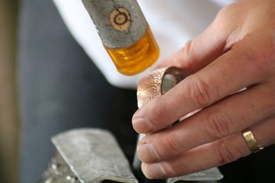 Close-up of hand holding machine