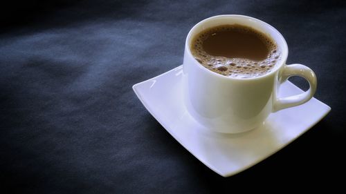 High angle view of coffee cup on table