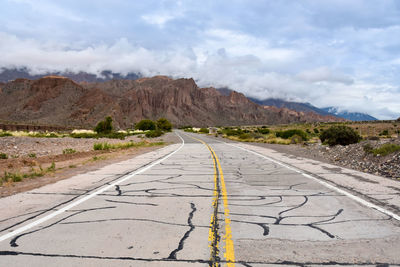 Road amidst landscape against sky