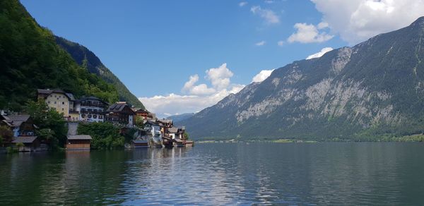 Scenic view of lake and mountains against sky