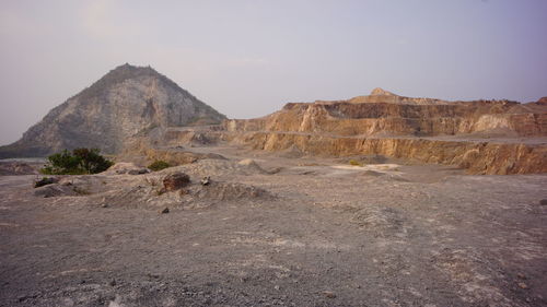 Rock formations in desert against sky