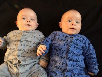 High angle view of baby boys on bed