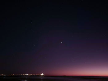 Scenic view of sea against sky at night
