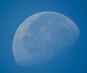 Low angle view of moon against blue sky