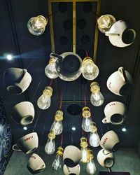 High angle view of illuminated lamps on table