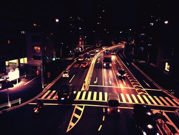 High angle view of light trails on road at night