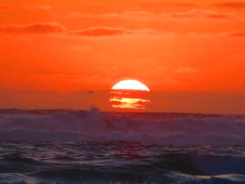 Scenic view of sea at sunset