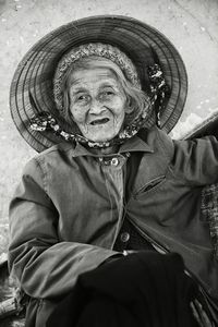 Portrait of senior woman sitting outdoors