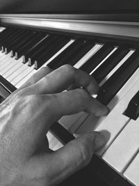 Low section of person playing piano
