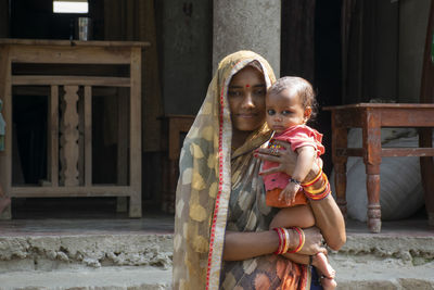 Portrait of mother and daughter in rural india 