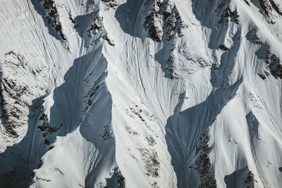 Close-up of snow covered ridges and spines of a mountain face, austria