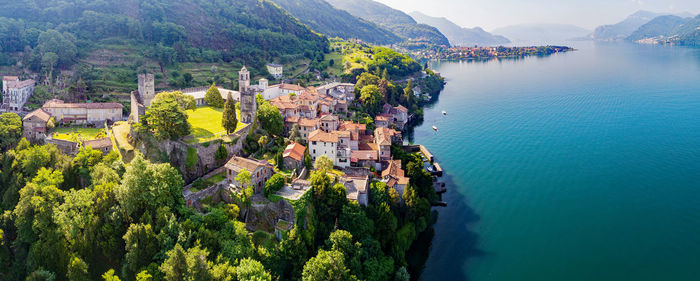 High angle view of buildings by sea