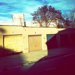 Empty road with buildings in background