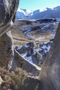 Aerial view of snowcapped mountains against sky