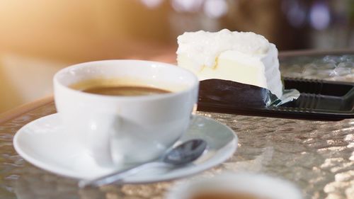 Close-up of coffee cup on table