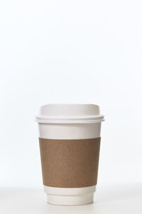 Close-up of coffee cup against white background