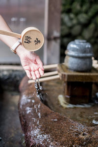 Close-up of hand holding water