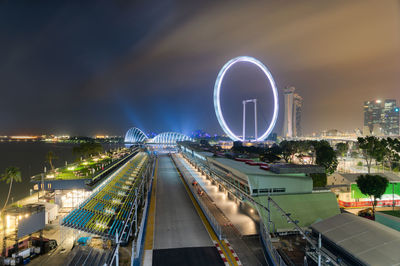 High angle view of illuminated ferris wheel against sky