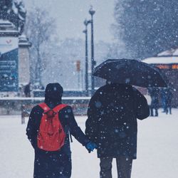 People walking on snow covered street