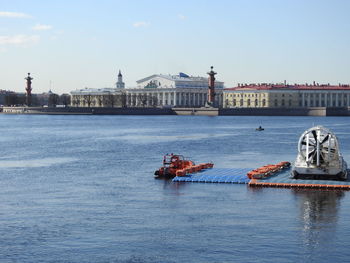 Ferry boat in river with city in background