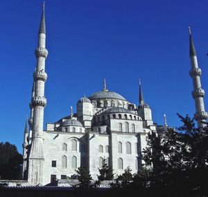 Low angle view of church against blue sky