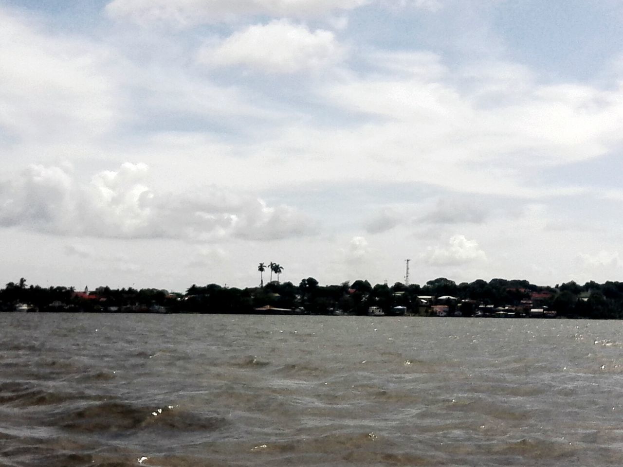 water, waterfront, sky, sea, cloud - sky, rippled, tranquil scene, tranquility, scenics, nature, cloud, cloudy, river, building exterior, beauty in nature, built structure, architecture, day, outdoors, no people