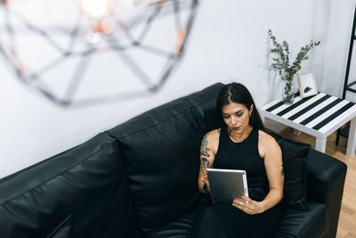 Portrait of a business woman during a break in the office using