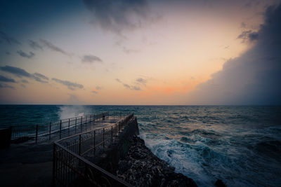 Scenic view of sea against sky during sunset