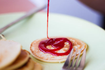 Pancakes with jam on plate