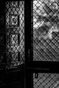 Full frame shot of metal fence against building