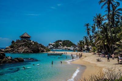 Scenic view of beach against blue sky