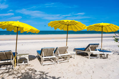 Lounge chairs and parasols on beach