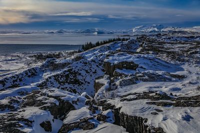 Scenic view of sea against sky during winter