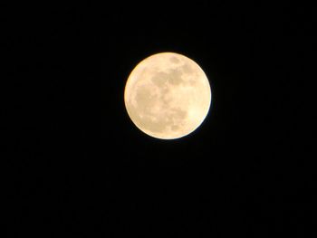 Low angle view of full moon at night